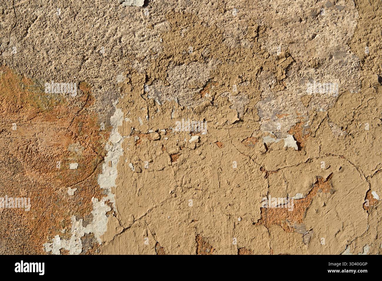 An old painted wall with peeling paint as a background Stock Photo