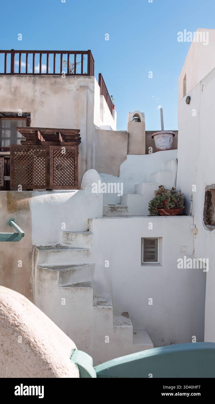 Greece Railing Traditional white Cycladic architecture with narrow steps and wooden ...