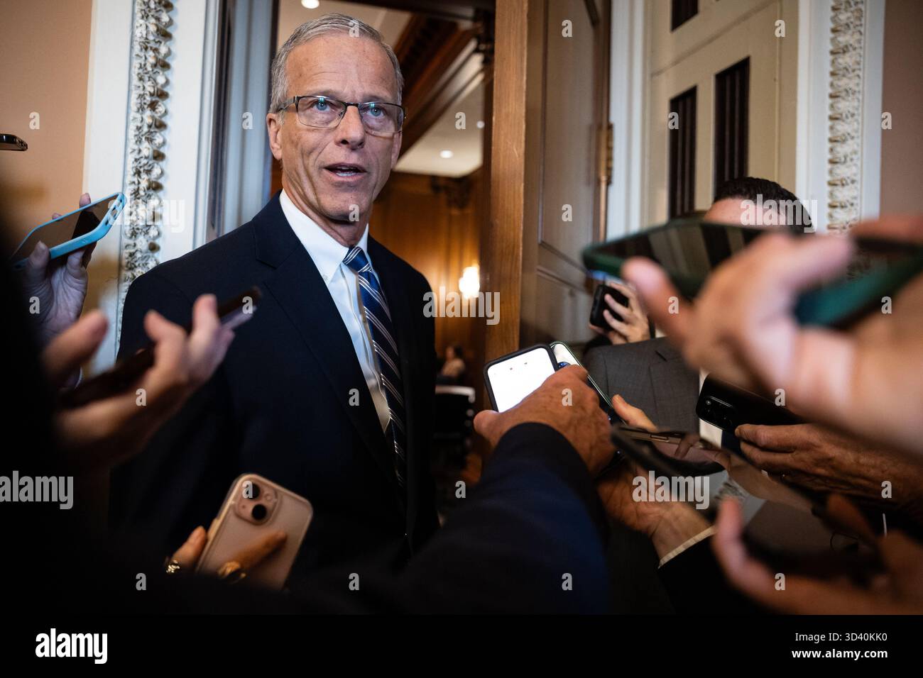 Senate Majority Leader John Thune (R-S.D.) speaks with reporters as he ...