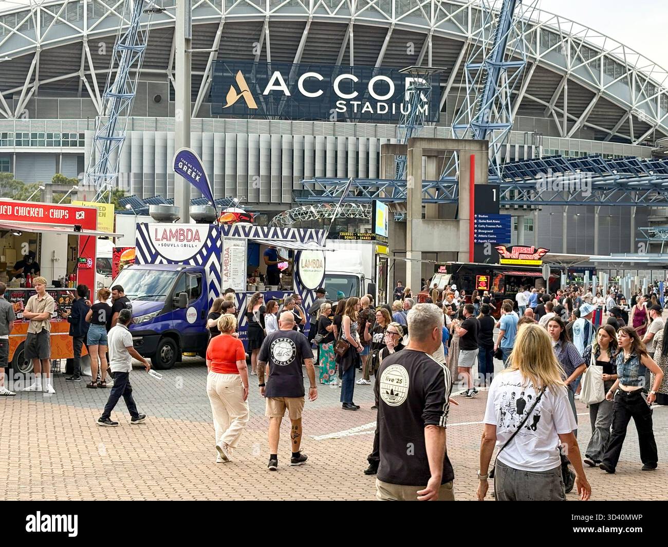 Oasis Live 25 tour, Sydney Accor Stadium, Oasis fans outside the Accor arena before the first night Oasis concert, Homebush,Sydney,Australia - Smartphone Captured Stock Image