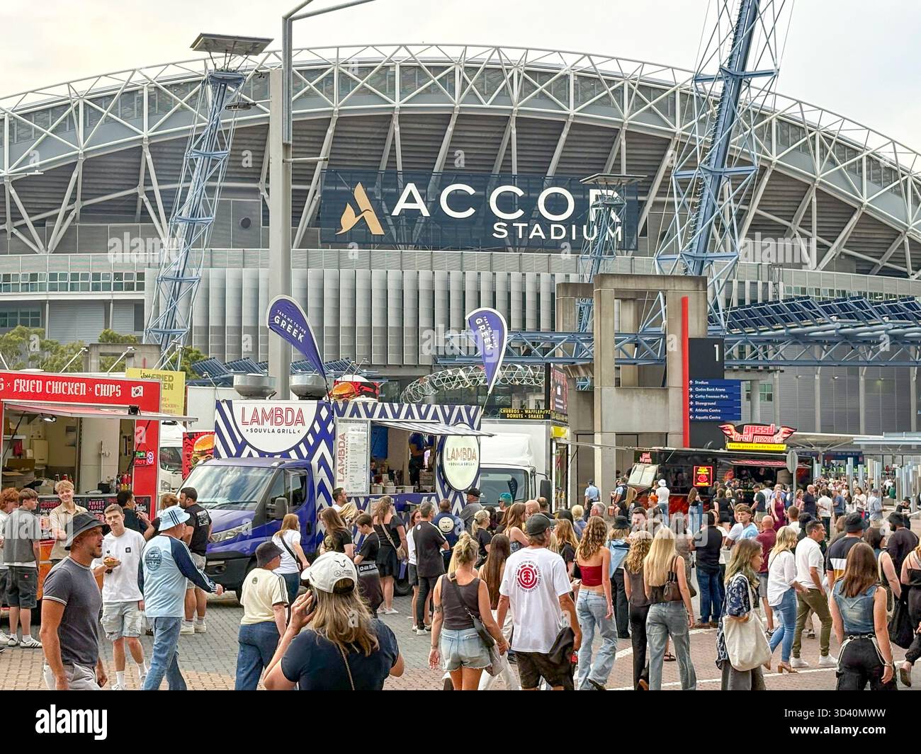 Oasis Live 25 tour, Sydney Accor Stadium, Oasis fans outside the Accor arena before the first night Oasis concert, Homebush,Sydney,Australia - Smartphone Captured Stock Image