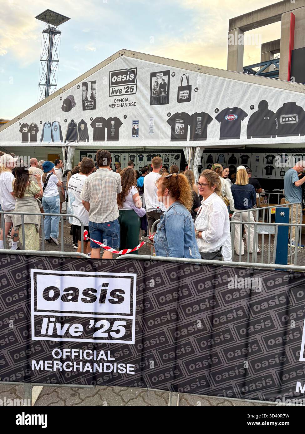 Oasis Live 25 tour, Sydney Accor Stadium, Oasis music fans queue to buy t shirts, bucket hats and mementos from Official merchandise shop, Australia - Smartphone Captured Stock Image