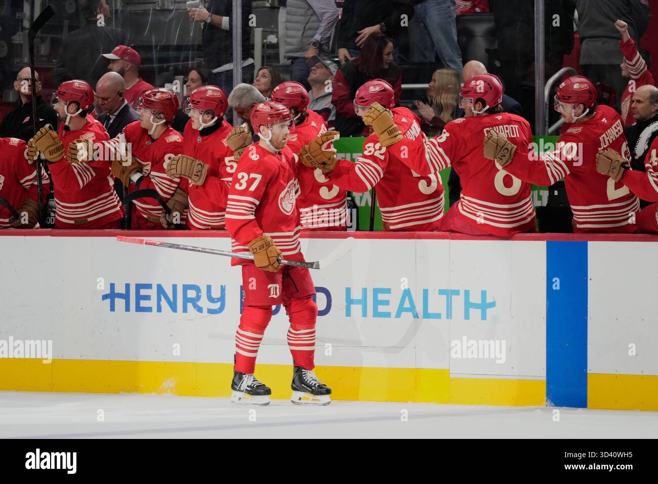 Detroit Red Wings left wing J.T. Compher (37) celebrates with the bench ...