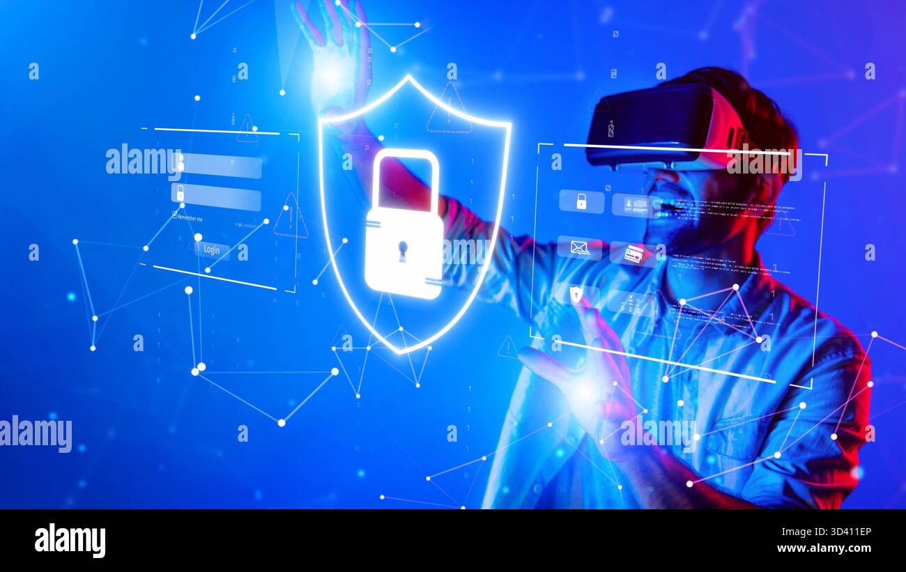 A man wearing a virtual reality headset interacts with digital elements representing data protection and security in a dynamic blue environment Stock Photo