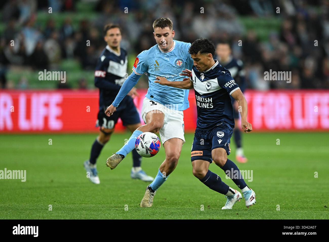 Max Caputo of Melbourne City (centre) kicks the ball during the A ...