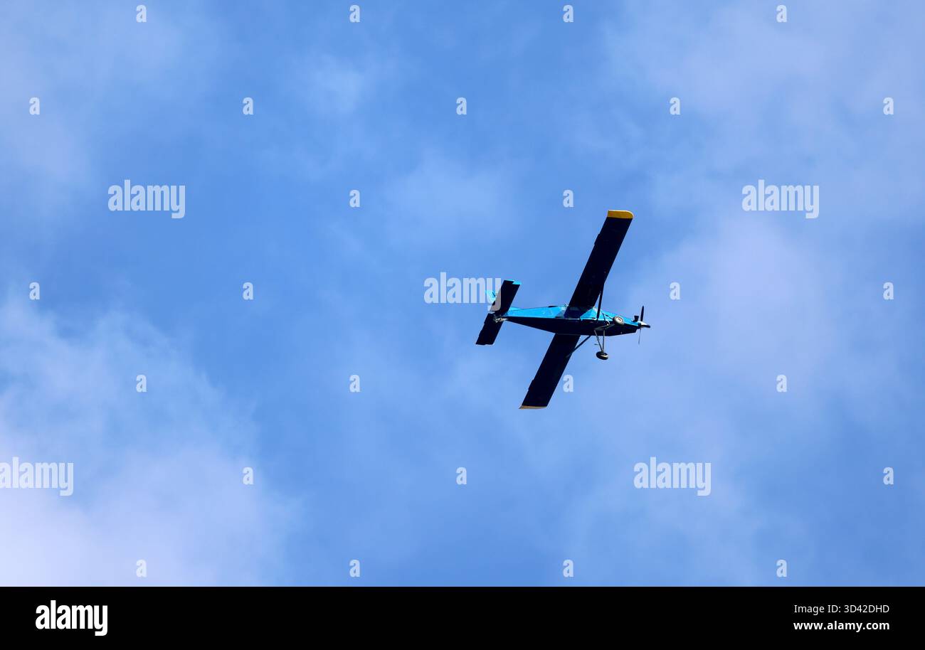Airplane in a blue sky Stock Photo