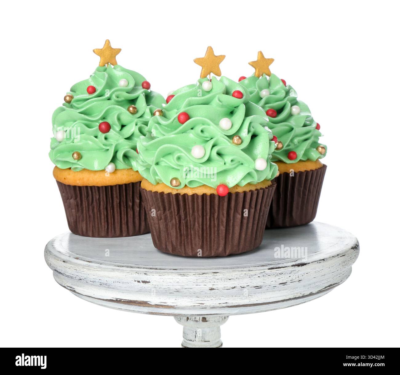 Christmas tree shaped cupcakes isolated on white Stock Photo