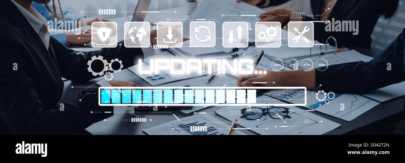 Professionals Engaged in Collaborative Project Planning as Digital Progress Indicators and Graphical Elements Display on Screen in Modern Office Stock Photo