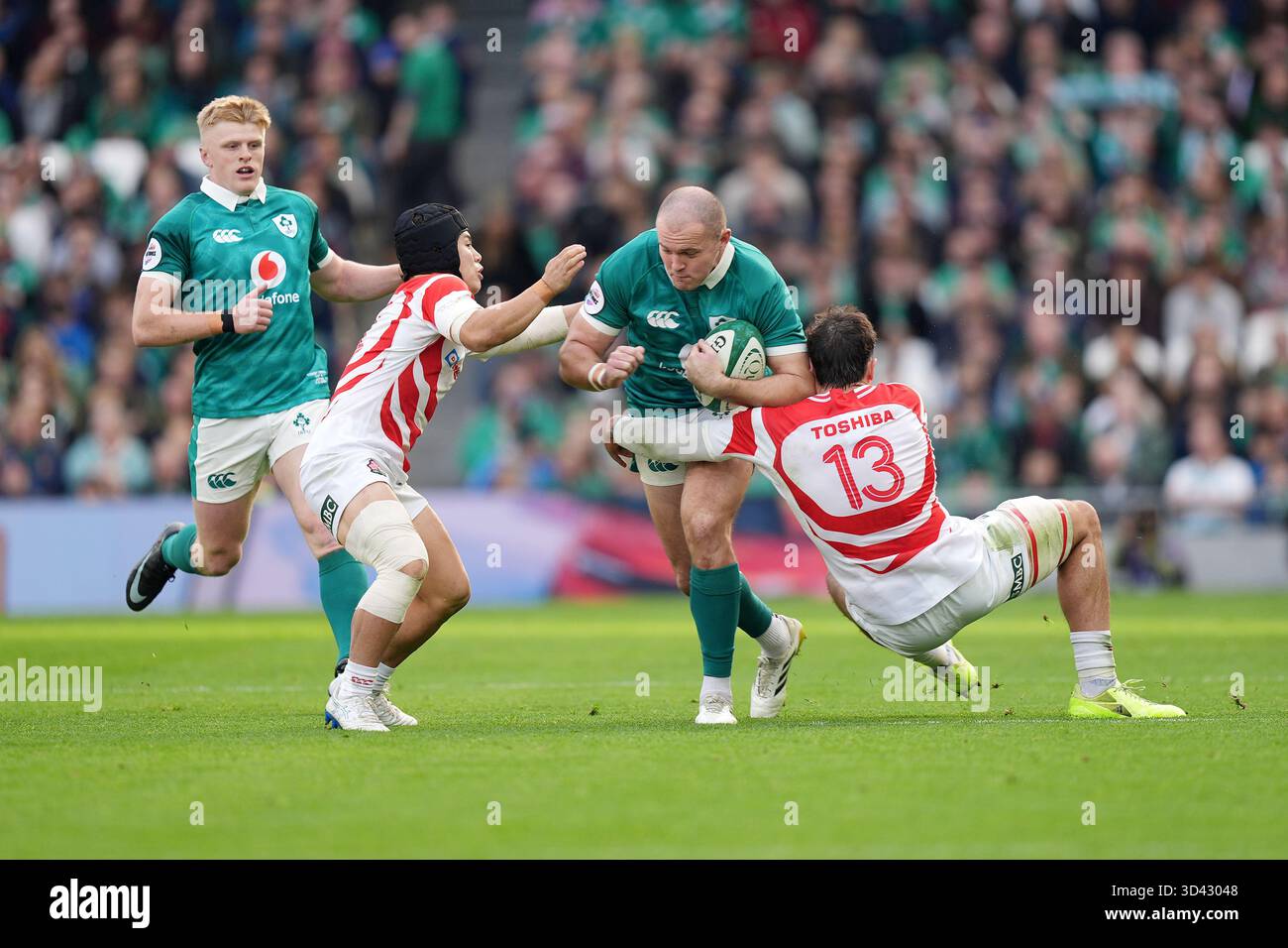Ireland's Jacob Stockdale is tackled by Japan's Kippei Ishida (second ...