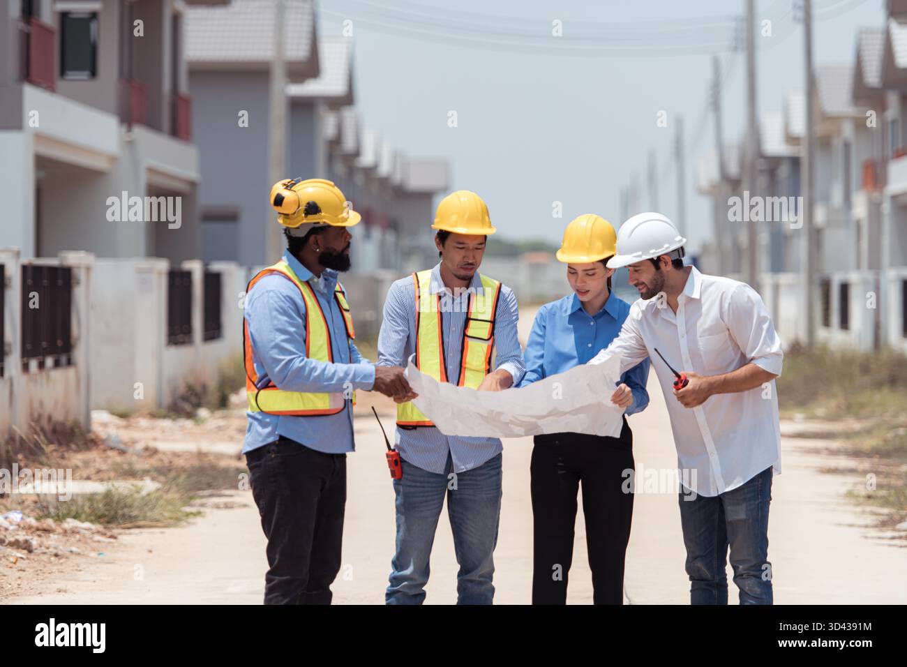 Group of architects and engineers work together to assess the ...