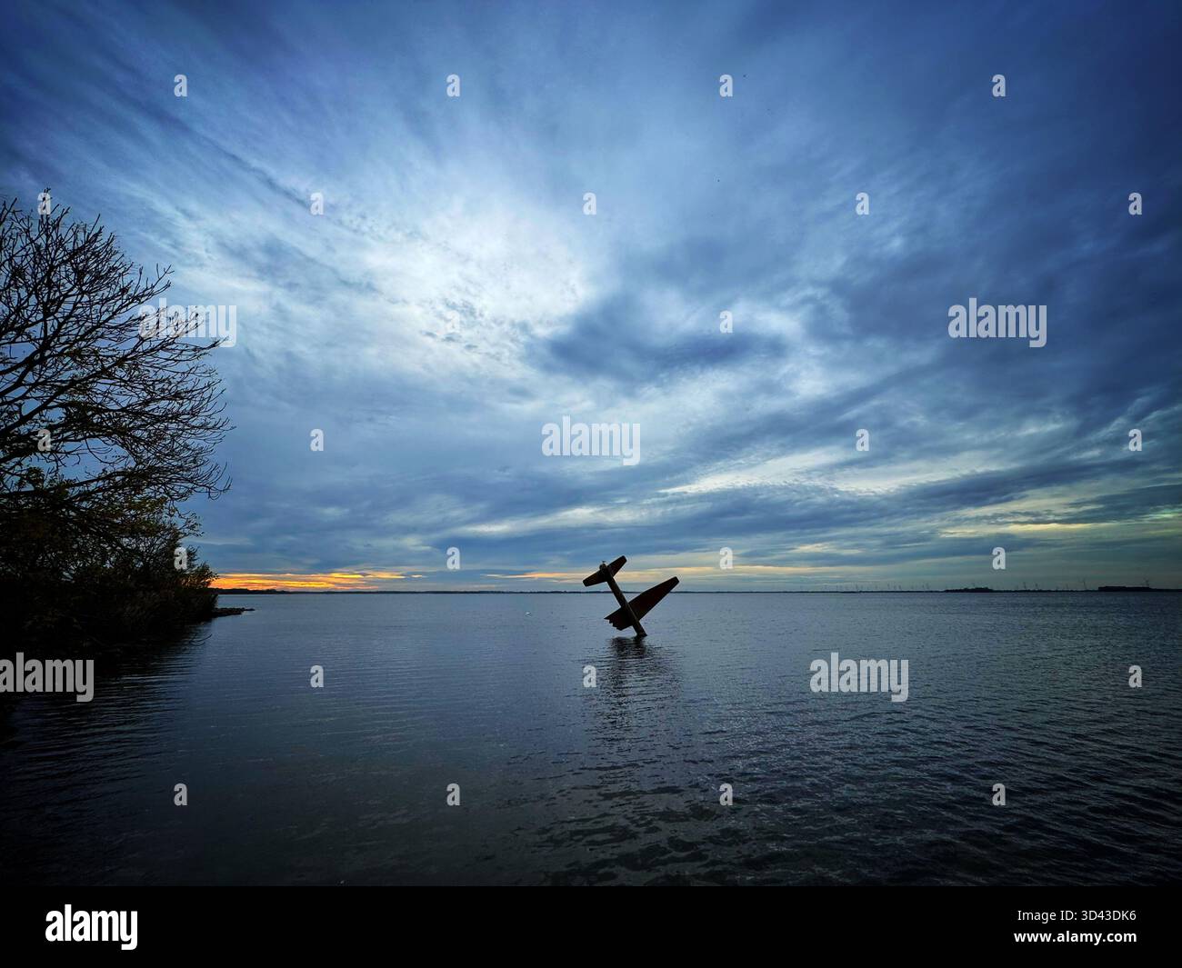 Sculpture by Arend Kleinpaste - Memorial to Allied Fliers in Harderwijk, Netherlands, dusk. - Smartphone Captured Stock Image