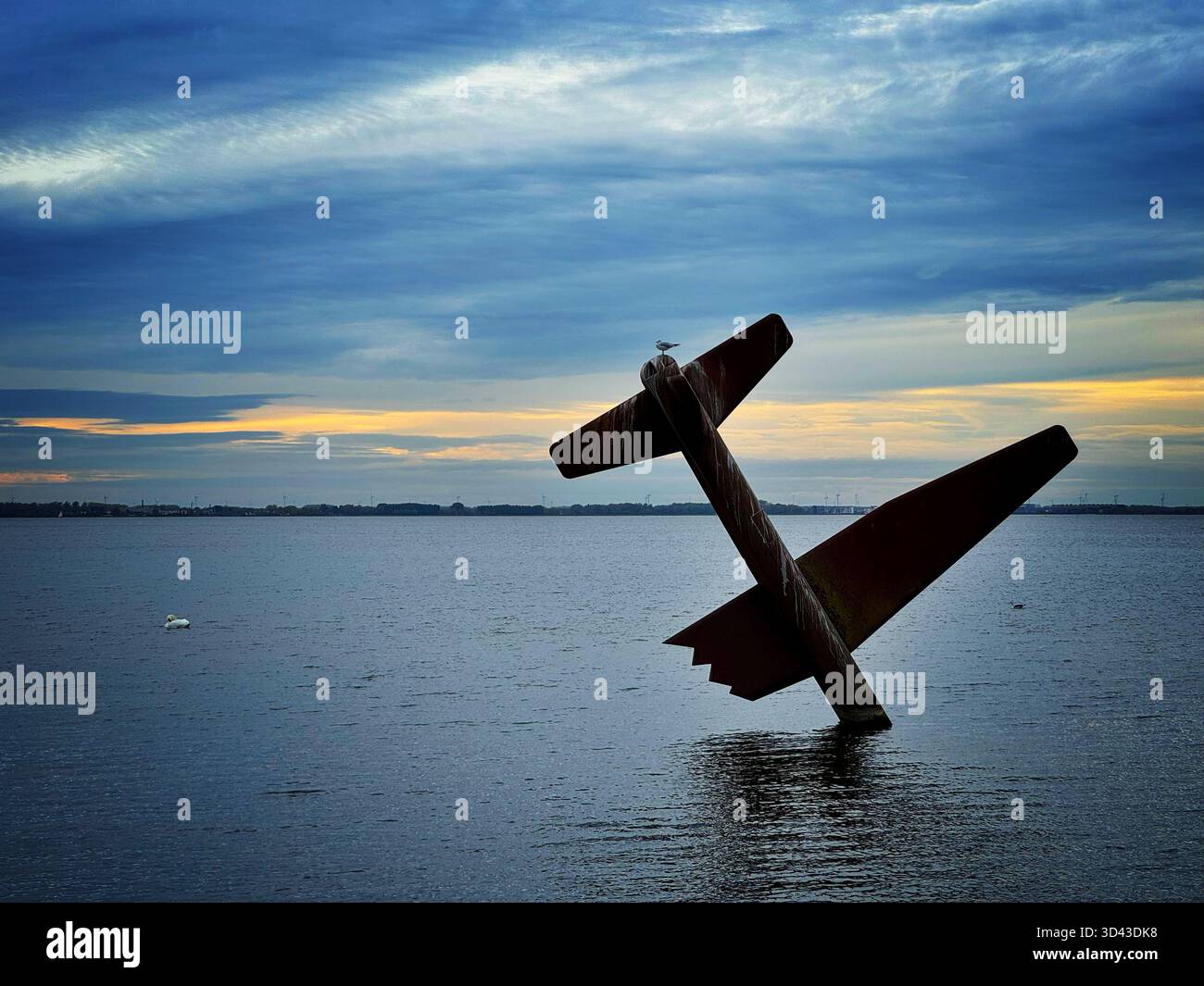 Sculpture by Arend Kleinpaste - Memorial to Allied Fliers in Harderwijk, Netherlands, dusk. - Smartphone Captured Stock Image