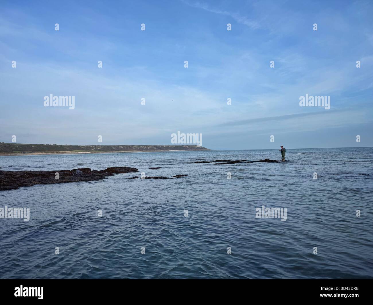 Lone sea angler at Port Eynon, Swansea, Gower, Wales. - Smartphone Captured Stock Image