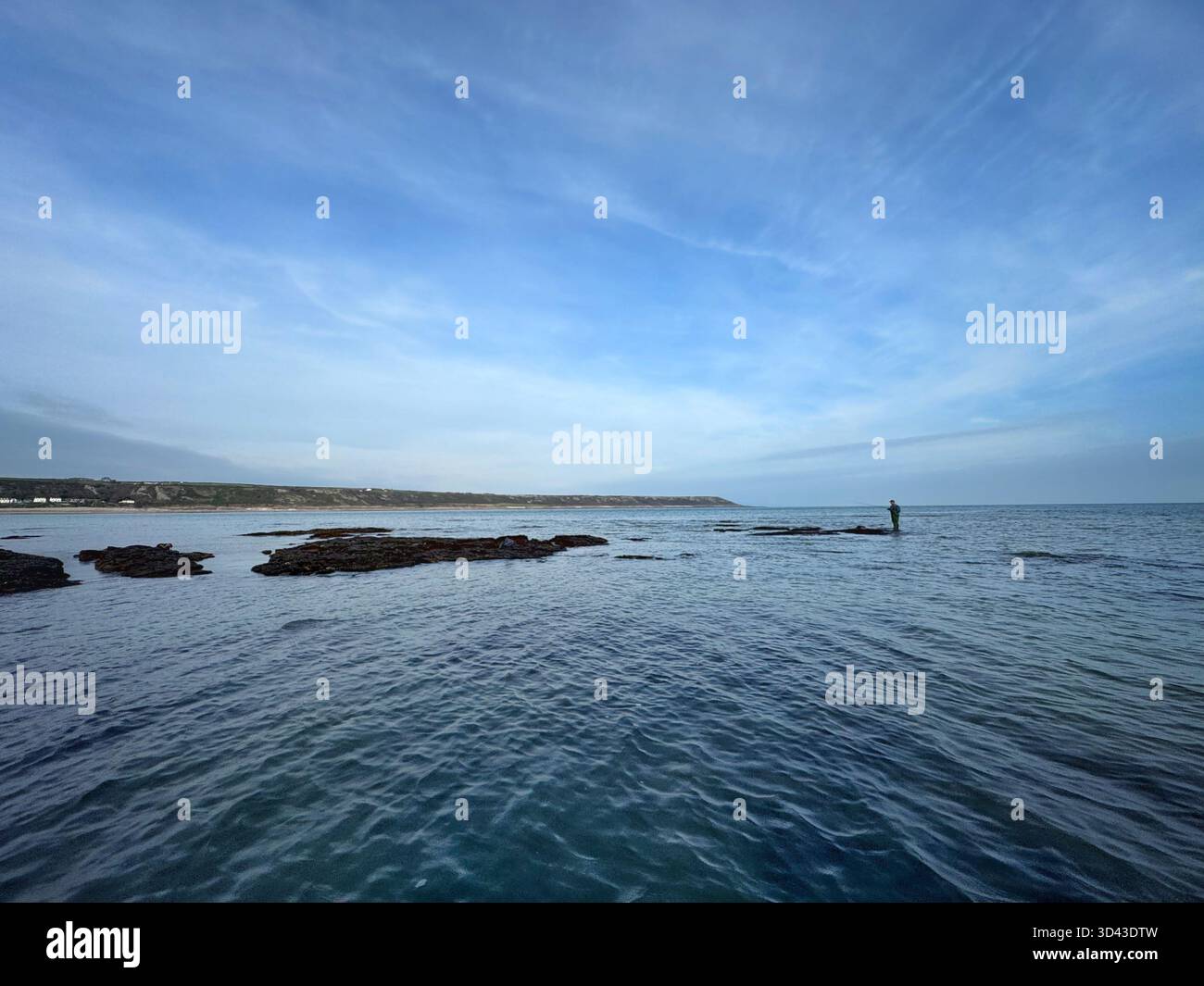 Lone sea angler at Port Eynon, Swansea, Gower, Wales. - Smartphone Captured Stock Image