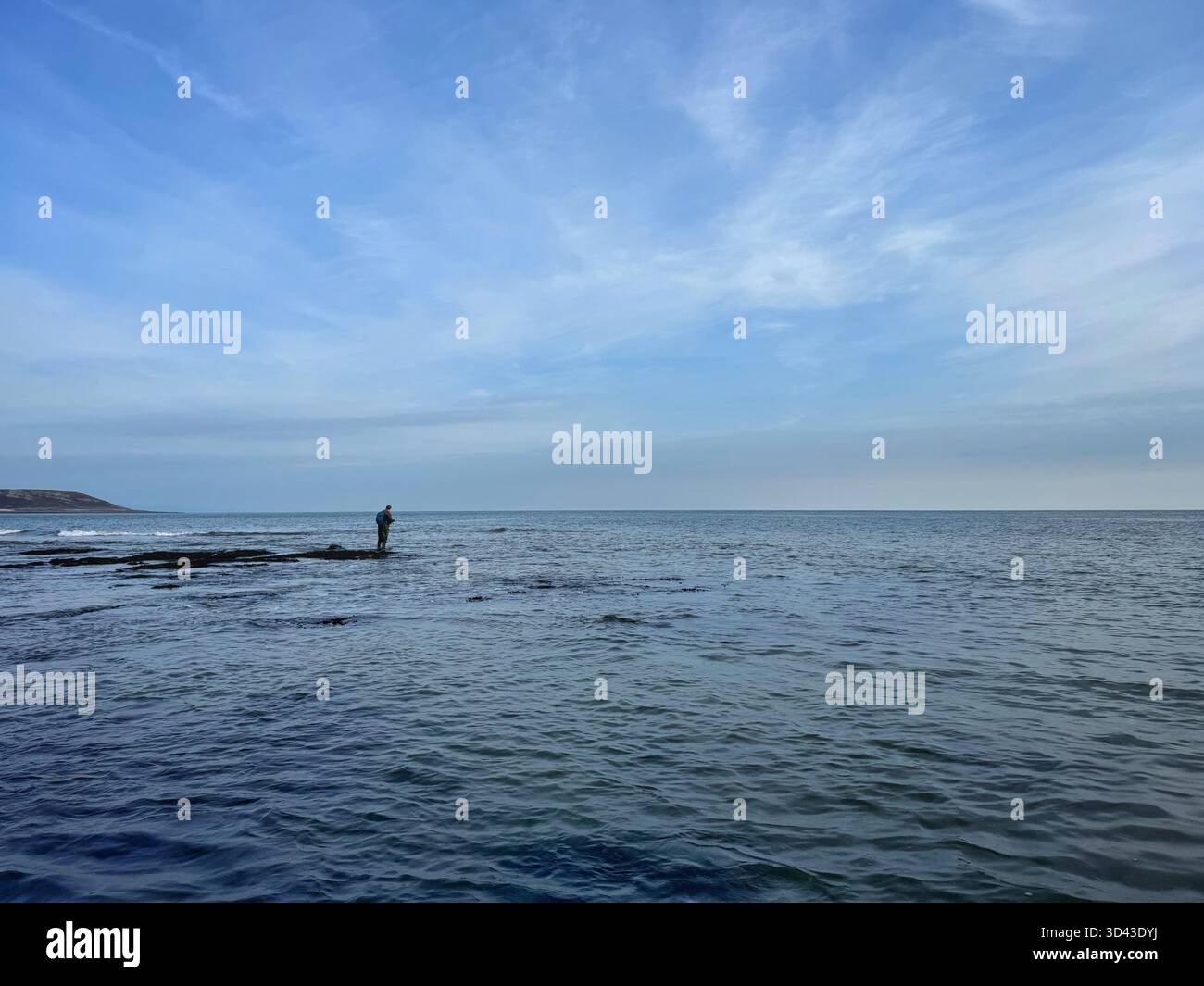 Lone sea angler at Port Eynon, Swansea, Gower, Wales. - Smartphone Captured Stock Image