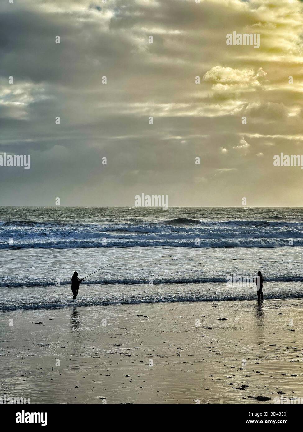 Bass anglers at Caswell Bay, Swansea, Gower, Wales. - Smartphone Captured Stock Image