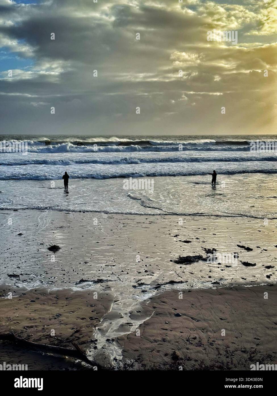 Bass anglers at Caswell Bay, Swansea, Gower, Wales. - Smartphone Captured Stock Image