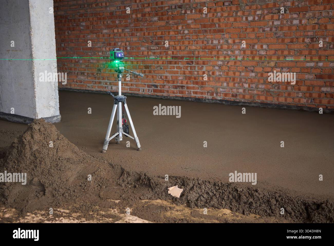 Precision alignment with laser on construction site, Tripod mounted ...