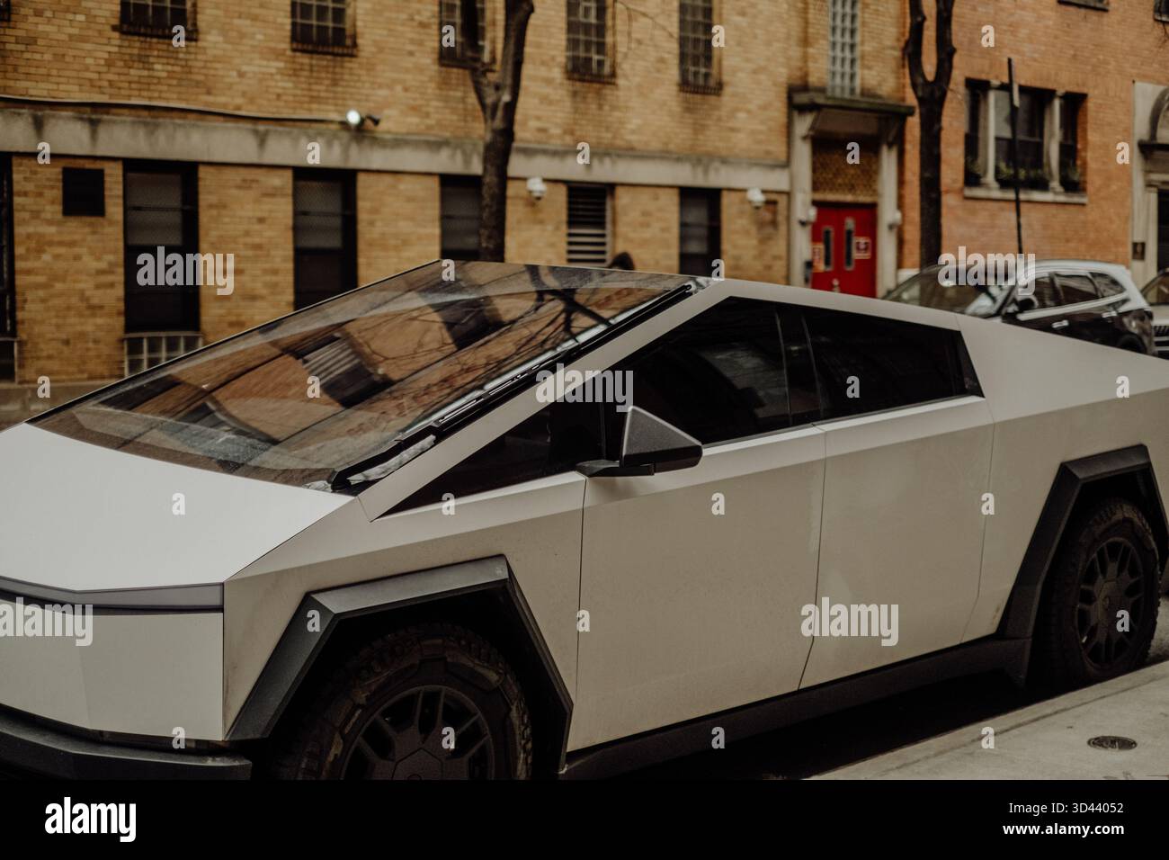Tesla Cybertruck on New York City streets, futuristic design meets modern urban lifestyle and architecture Stock Photo