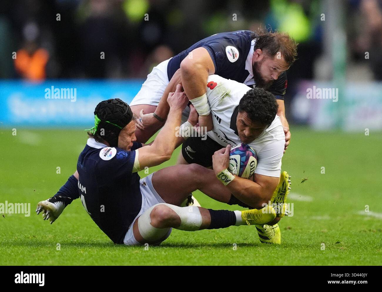 New Zealand's Caleb Clarke is tackled by Scotland's Darcy Graham (left ...
