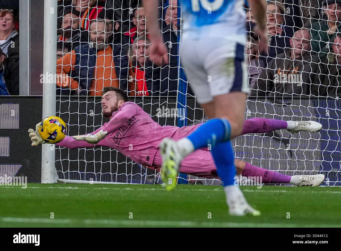 Goalkeeper Josh Keeley (24) of Luton Town saves a penalty during the ...
