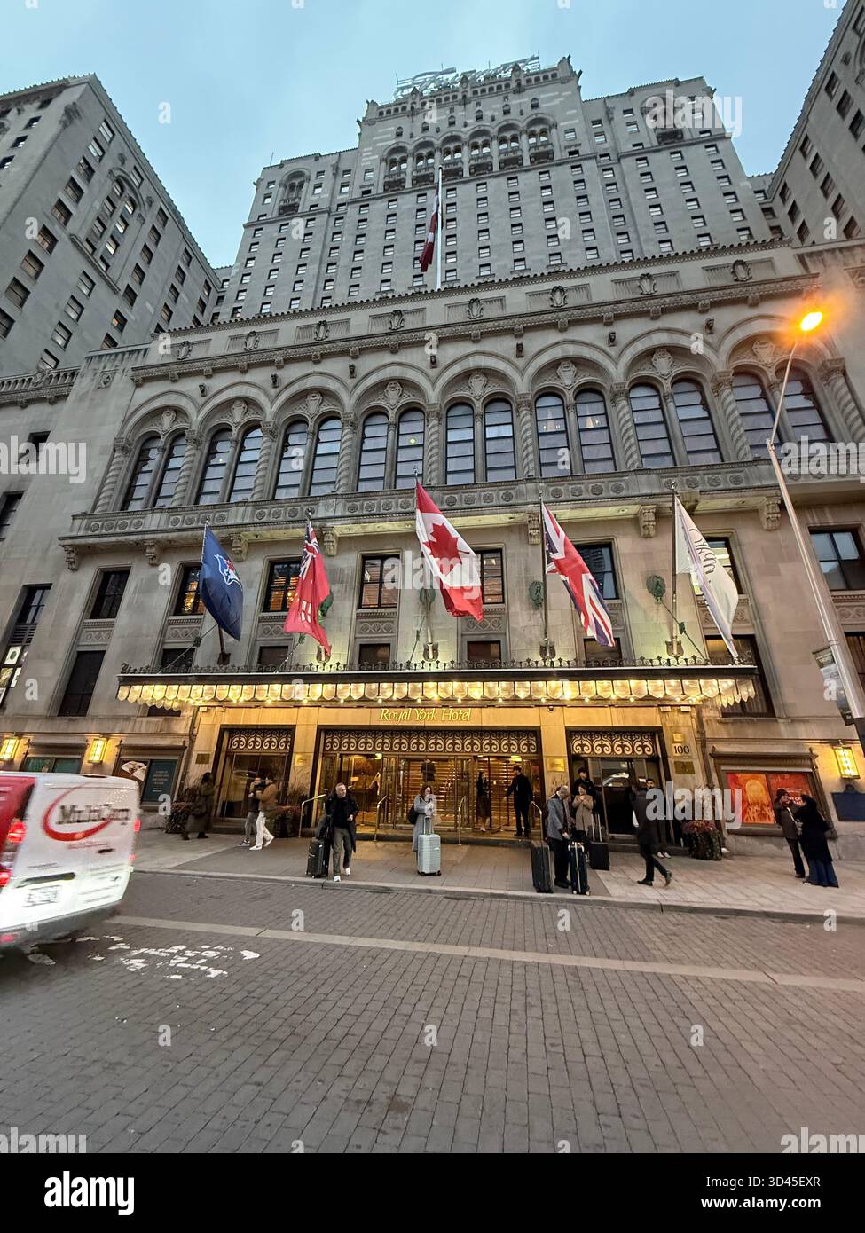 Historic building with international flags in downtown Toronto,The image captures architectural details and the multicultural character of the city. - Smartphone Captured Stock Image