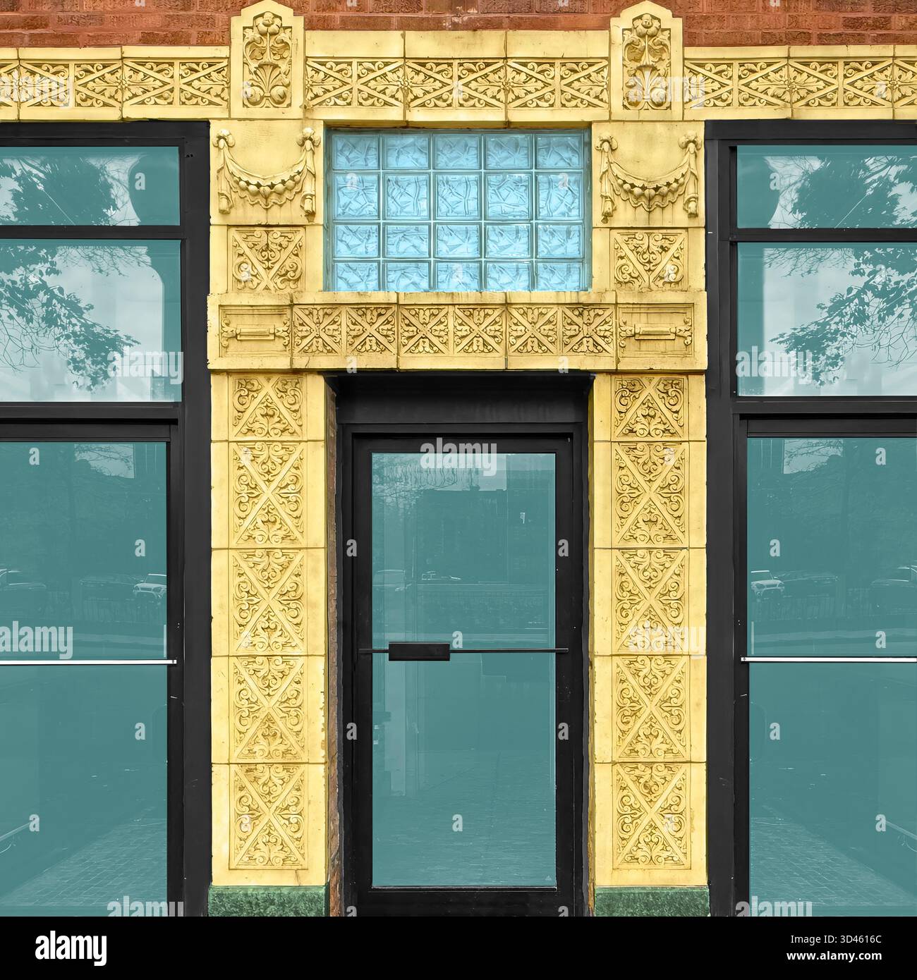 Yellow terra cotta storefront with blue glass panels and detailed ornamentation, capturing Chicago’s decorative architectural legacy - Smartphone Captured Stock Image