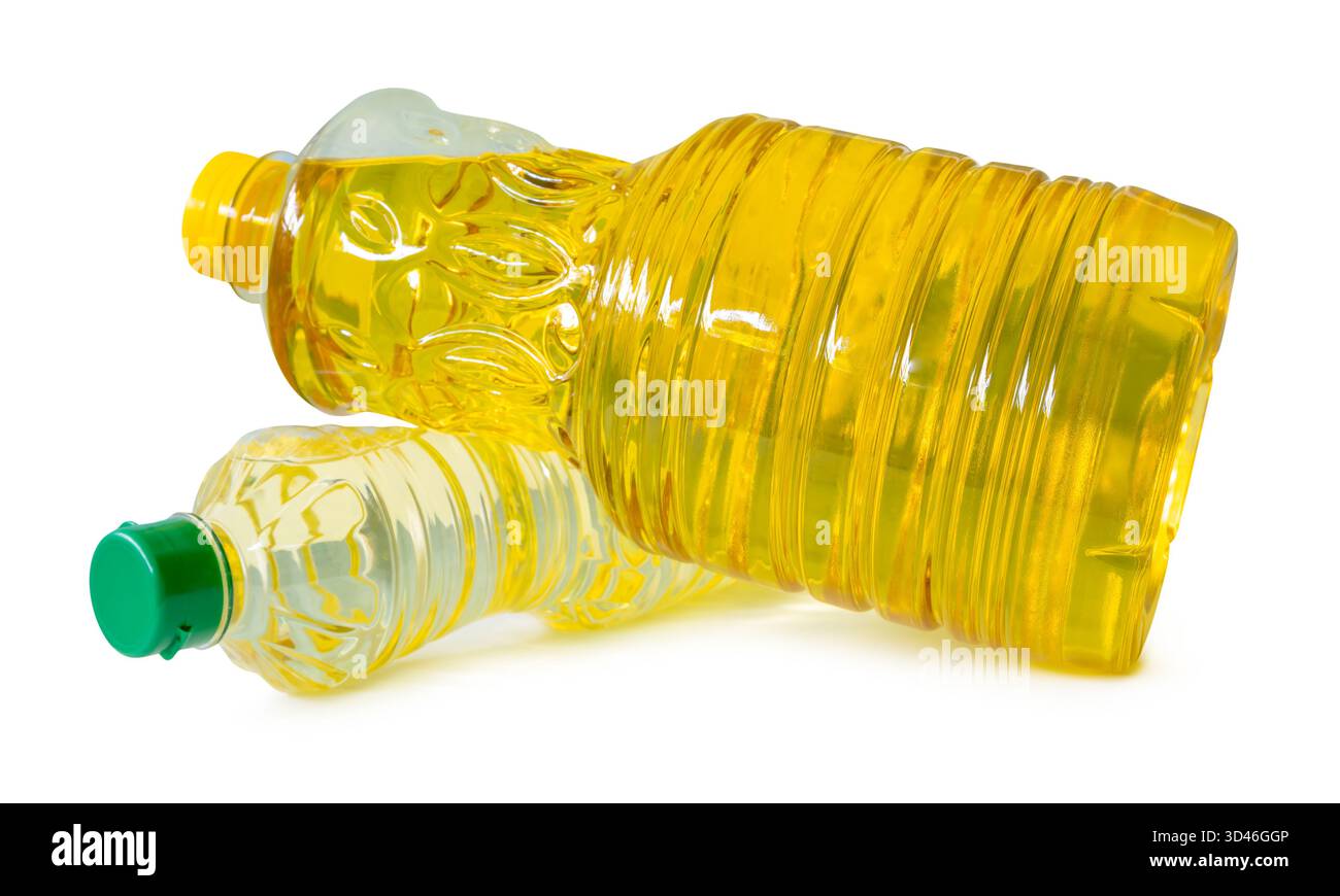 Two transparent plastic bottles of vegetable oil in palm and soybean ...