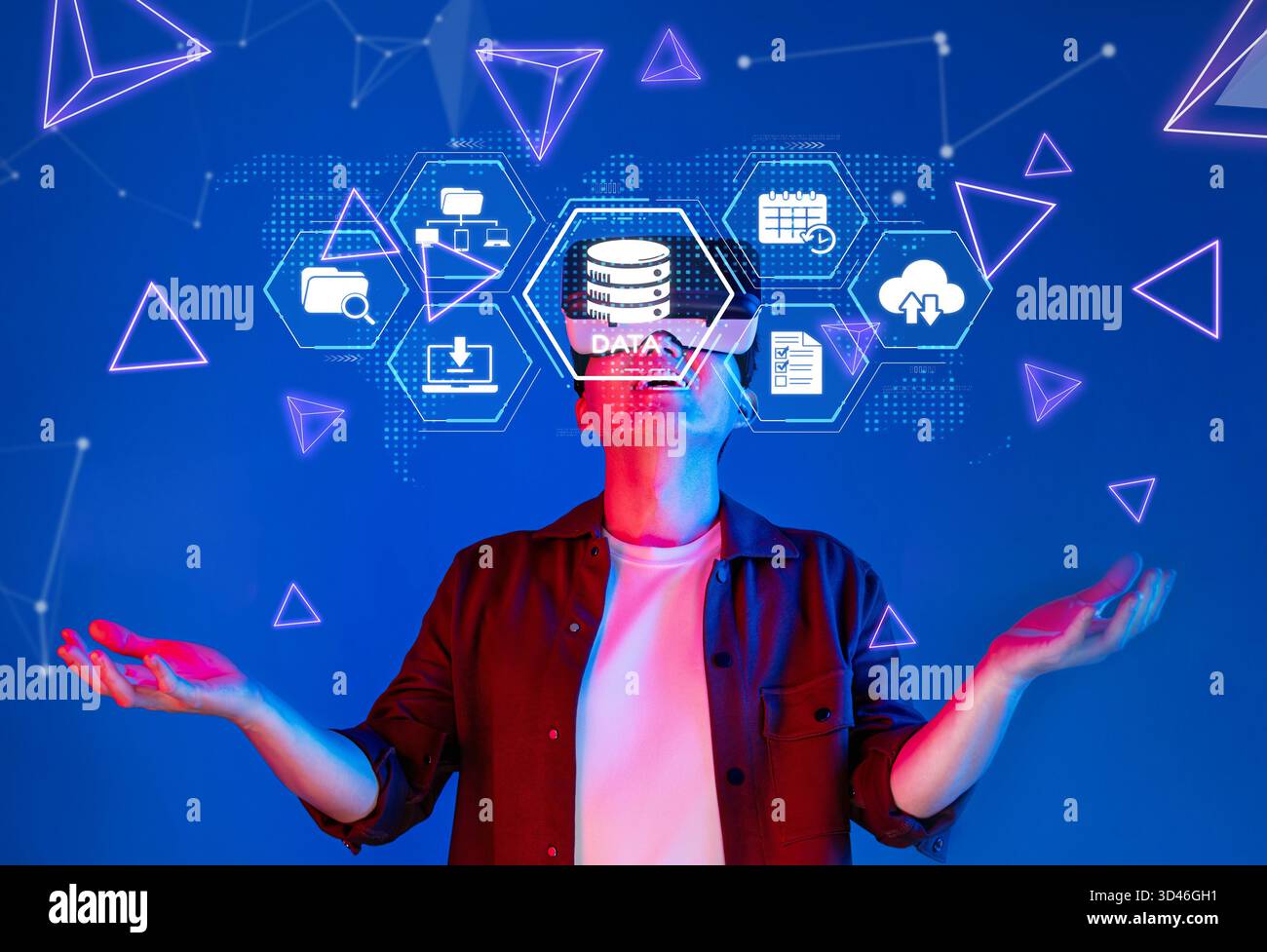 This image depicts a person interacting with digital data storage concepts in a vibrant, abstract environment, showcasing cloud computing and Stock Photo