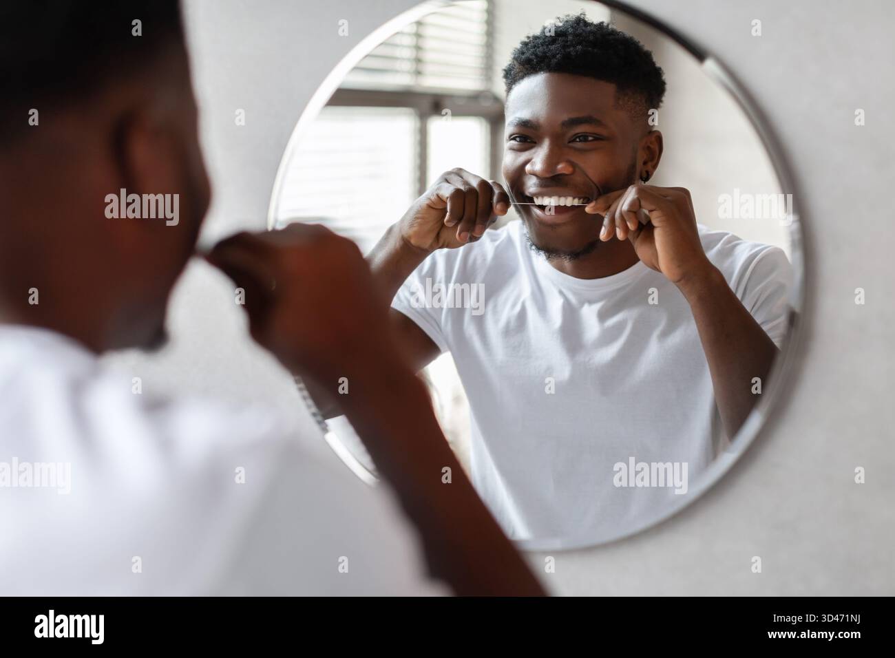 Happy black man flossing hi-res stock photography and images - Alamy