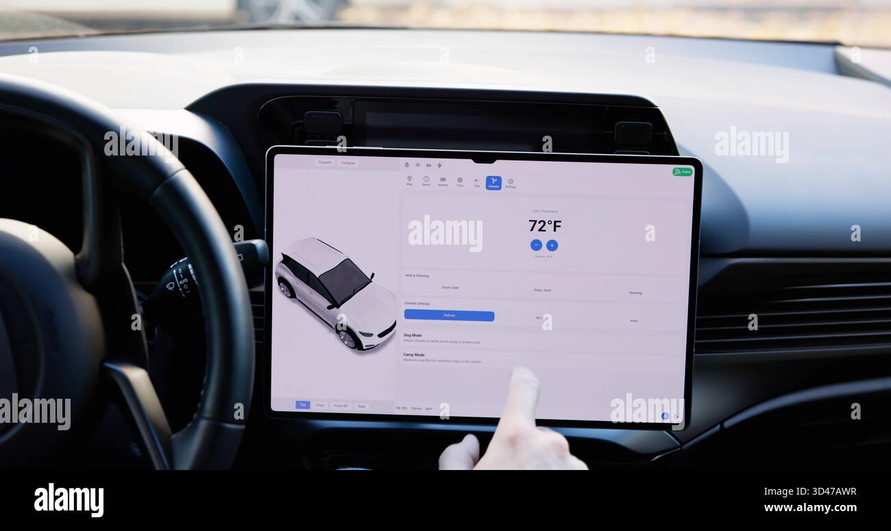 Young Male Using A Smart Touch Screen Dashboard. Stock Photo