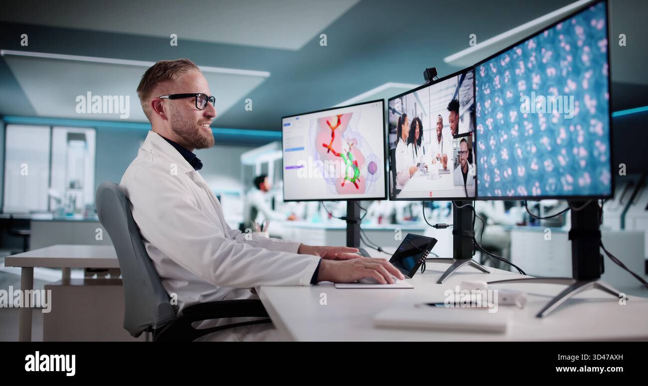 Collaborating Scientists In Lab Conduct Virtual Conference Using Innovative Technology Stock Photo