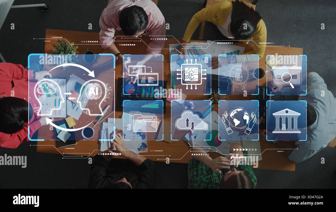 A diverse group engages in a collaborative brainstorming session, utilizing digital tools to explore artificial intelligence concepts and innovative Stock Photo