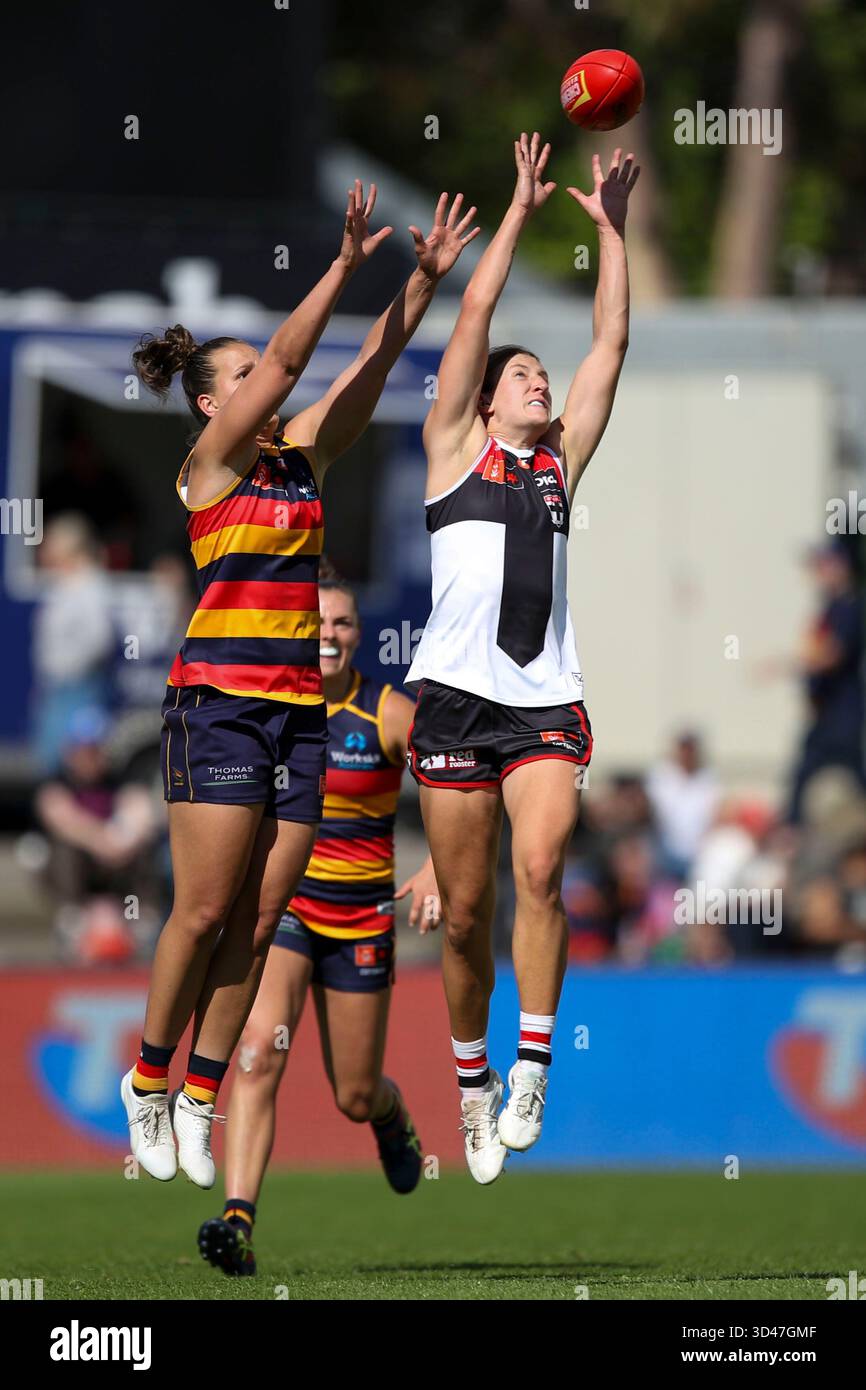 Danielle Ponter of the Crows and Tyanna Smith of the Saints compete for ...