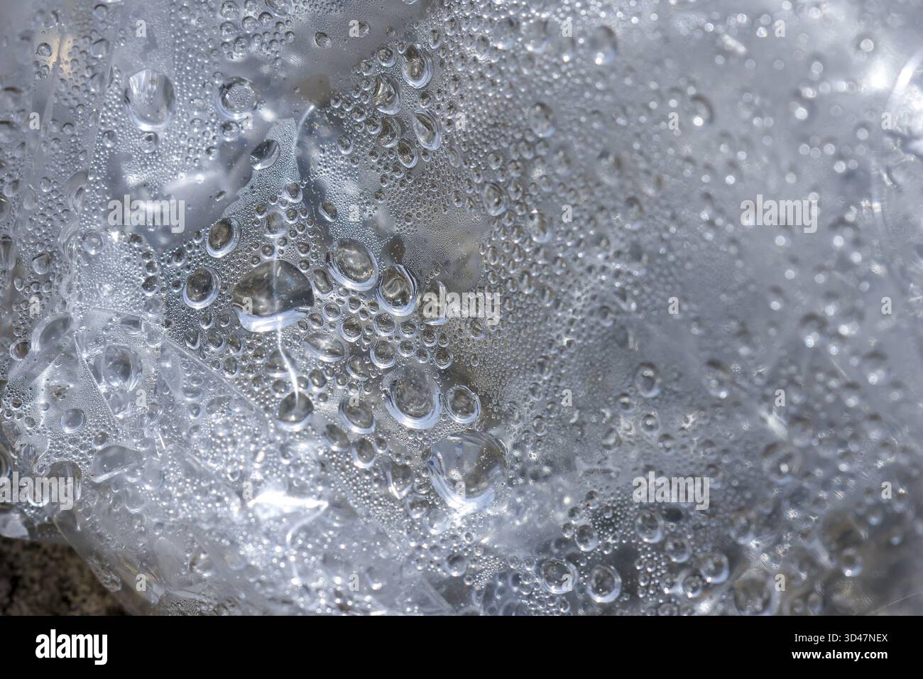 Fresh macro view of condensation with clear water drop and bubble on ...