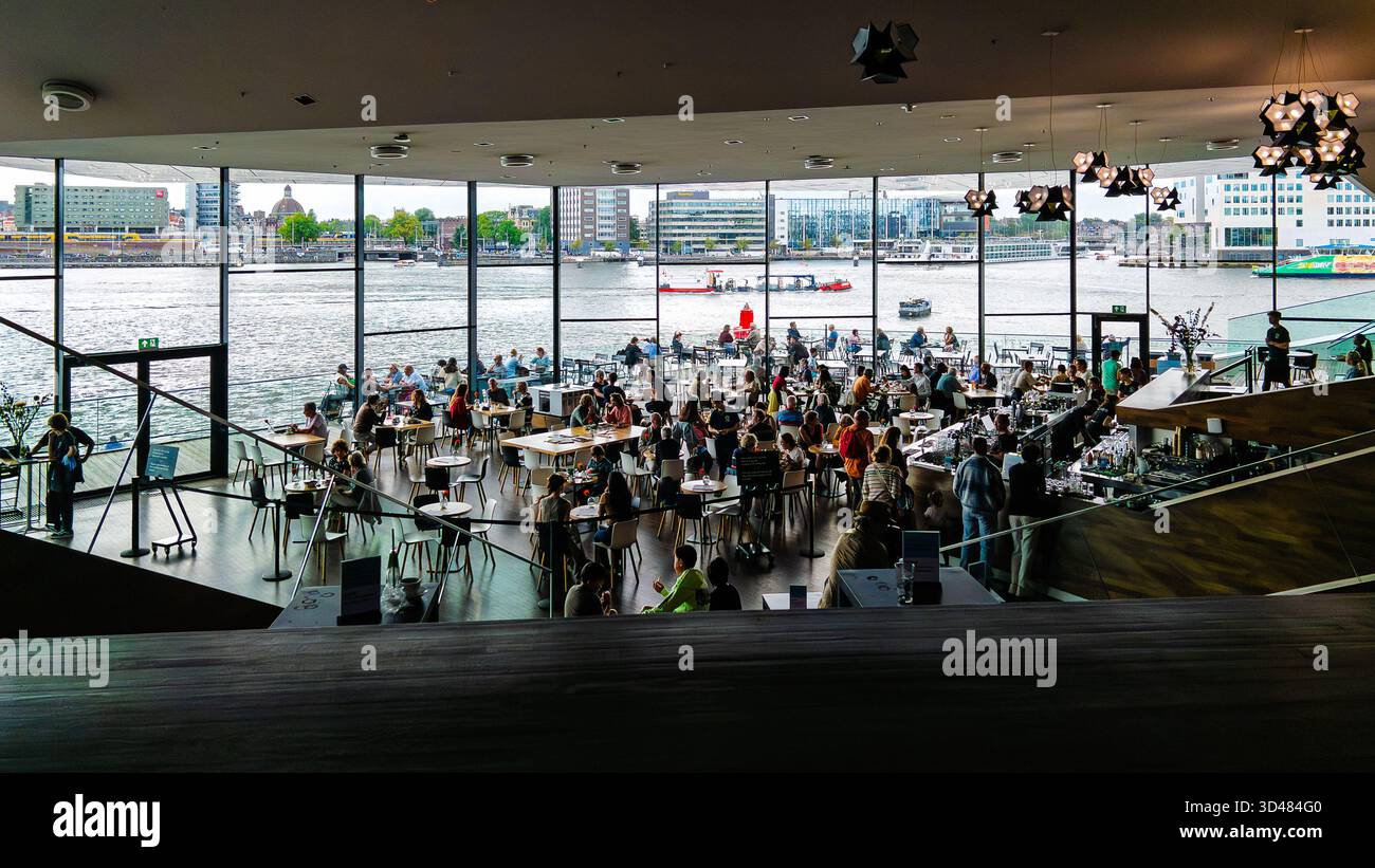 A view of the cafe in the Eye Film museum which looks out across the river in Amsterdam - Smartphone Captured Stock Image