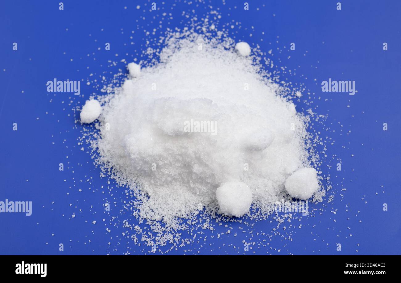 Thiourea powder on blue background Stock Photo