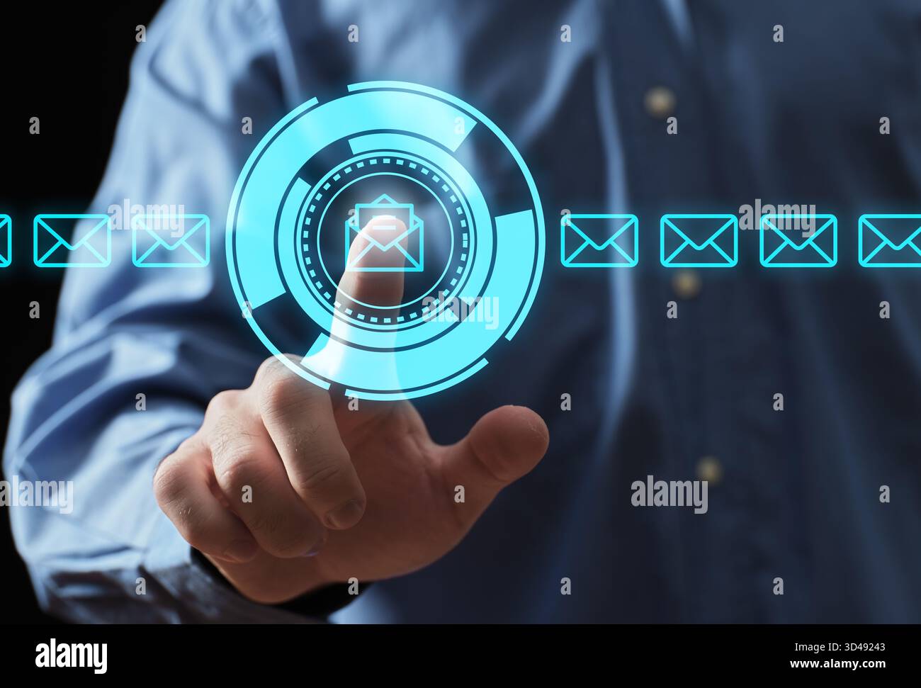 Hand selecting an email icon on a glowing digital interface, representing modern communication and futuristic technology Stock Photo