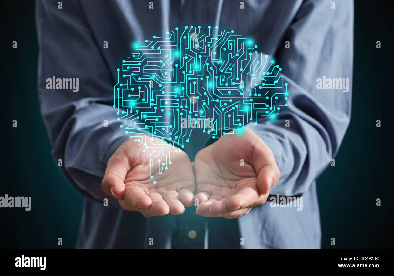 Person holding a glowing circuit board shaped like a human brain, symbolizing artificial intelligence, data, and innovative thinking Stock Photo