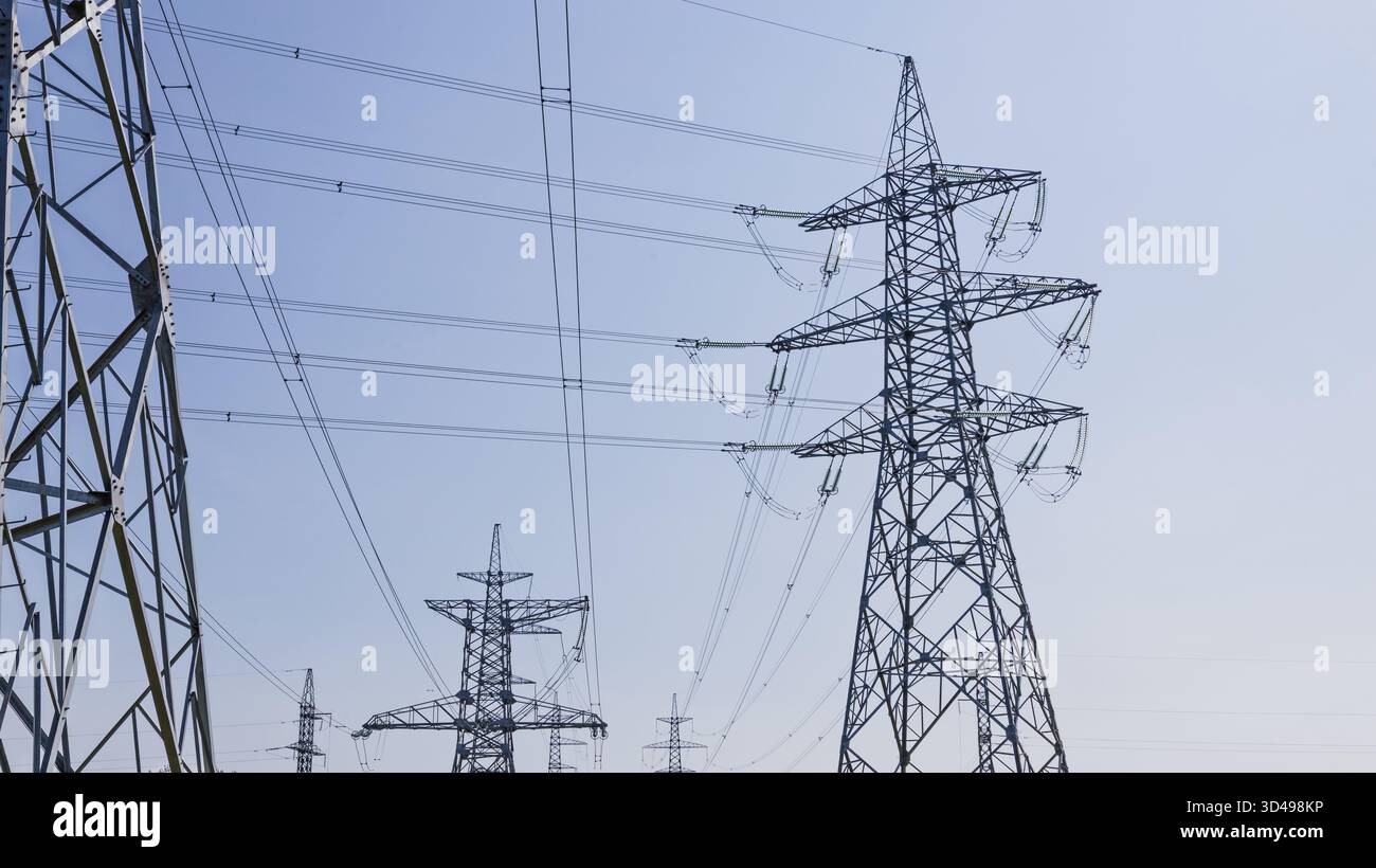 High Voltage Power Lines and Steel Transmission Towers Stock Photo - Alamy