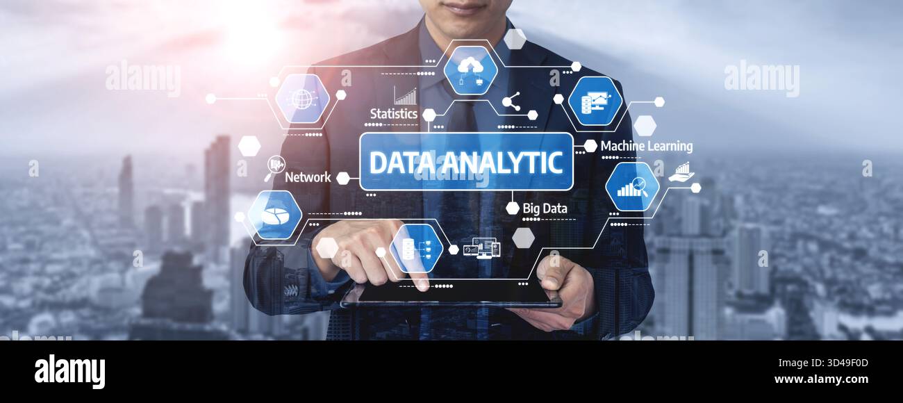 A business professional engages with a digital tablet displaying various data analytic icons against a modern city skyline that symbolizes innovation Stock Photo