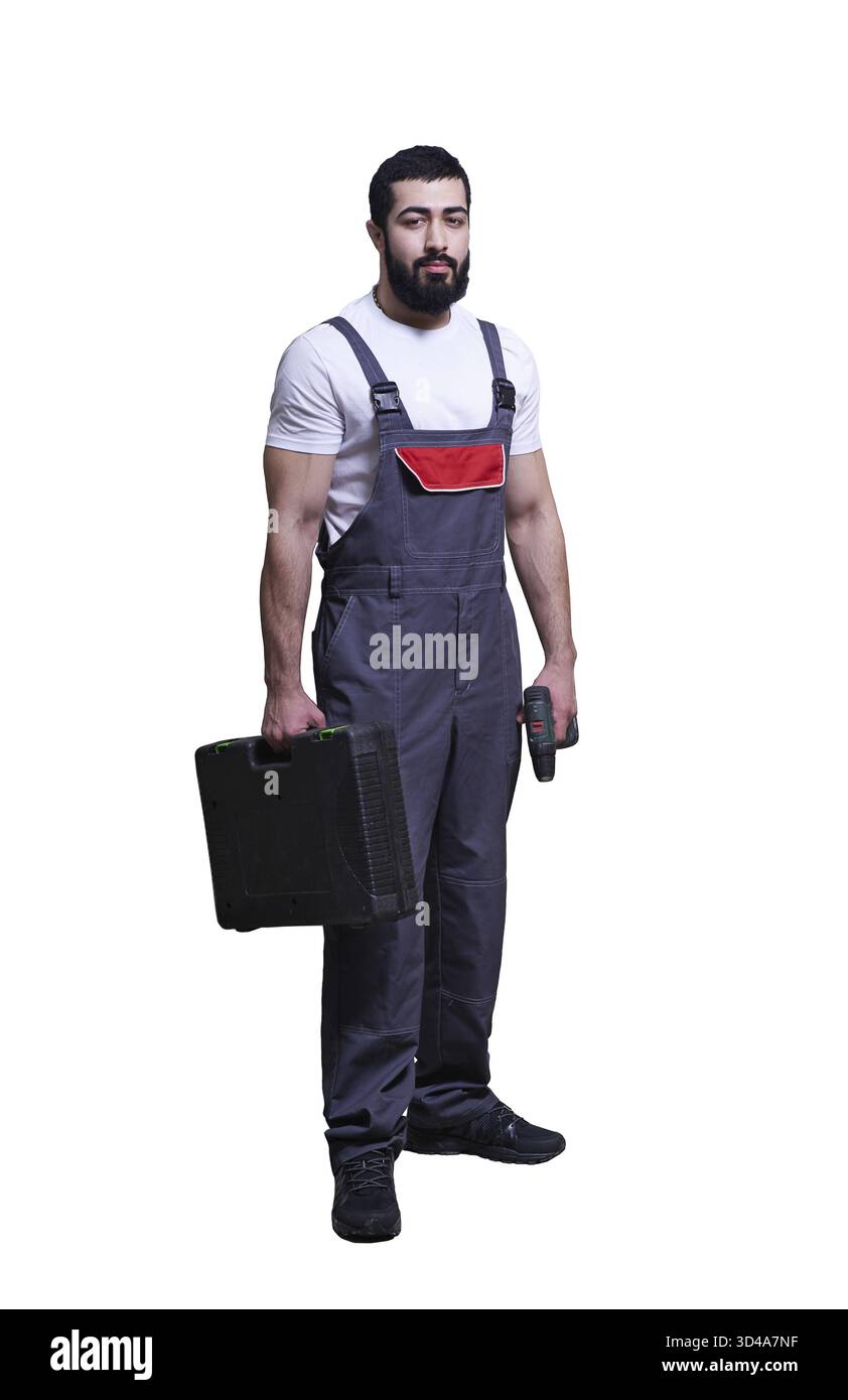 Smiling worker with red drill on white background Stock Photo