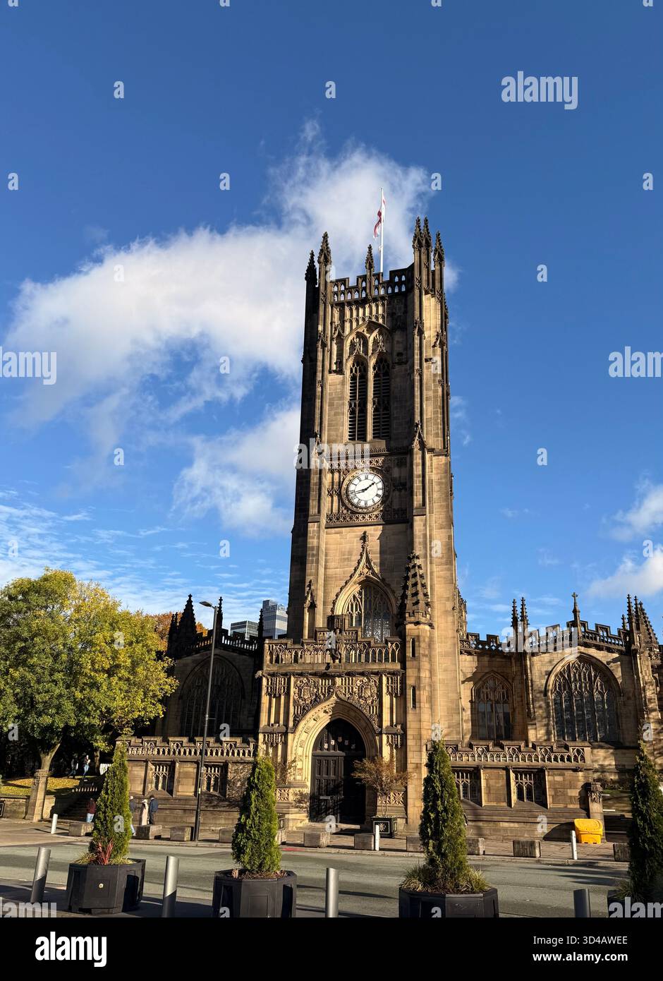 Manchester Cathedral against a blue sky in the City Centre - Smartphone Captured Stock Image