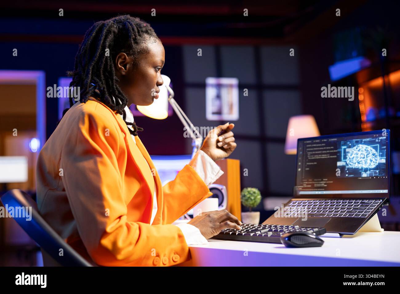 Programmer in living room office typing on keyboard, updating artificial intelligence neural networks, writing binary code scripts. Freelancing system administrator upgrading high tech AI Stock Photo