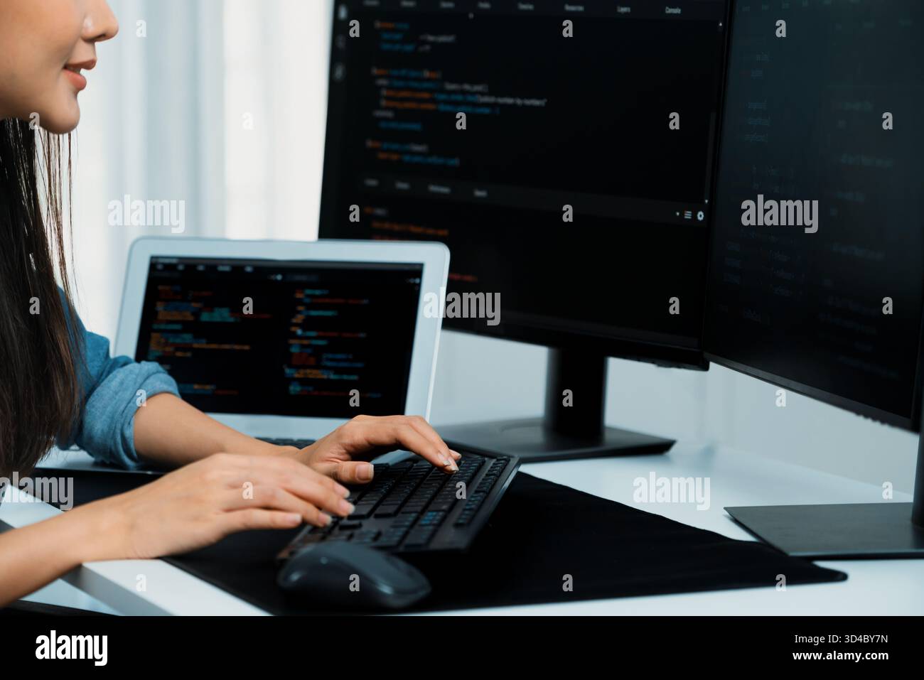 Cropped hands image of IT developer creating with typing information on pc with coding program information data website application, wearing jeans Stock Photo