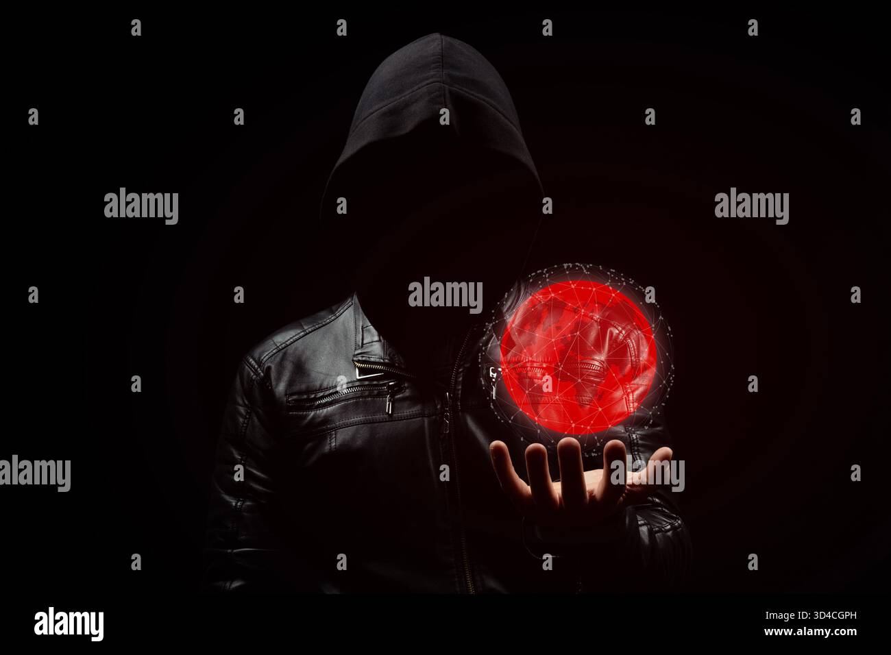 Close up to a faceless hooded hacker man in the shadows with a digital red earth globe in his left hand Stock Photo