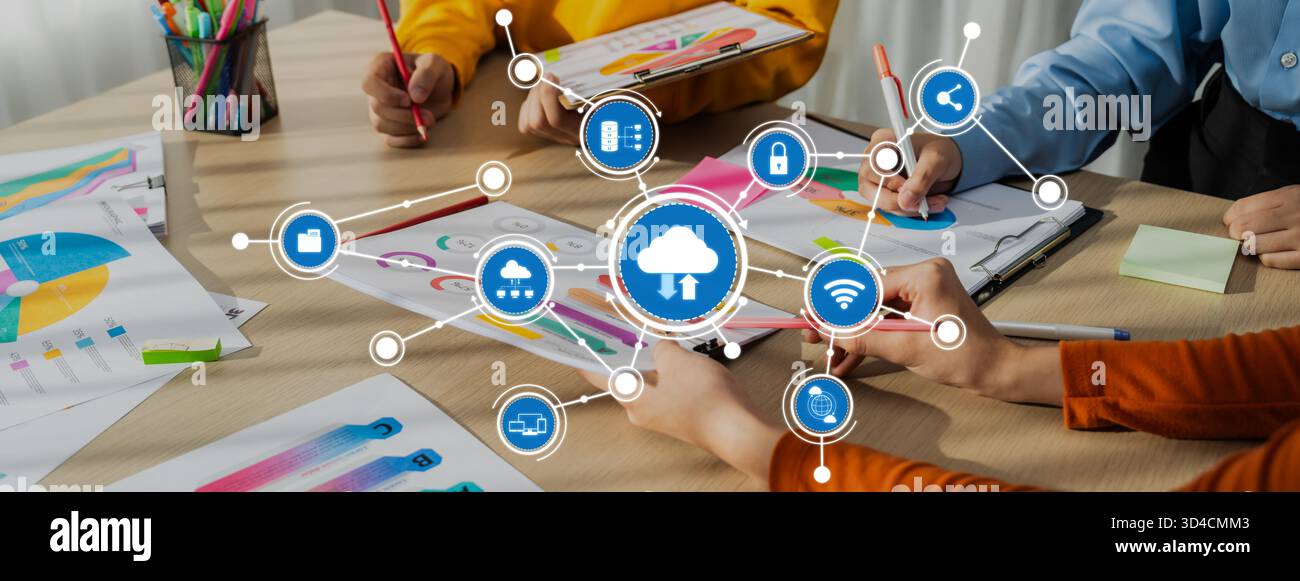 A dynamic scene depicting a collaborative work environment where a team engages in cloud computing concepts with colorful data visualizations and Stock Photo