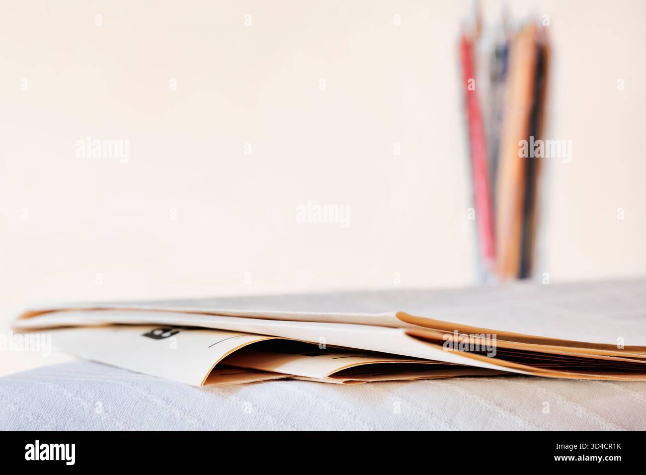 Folded newspapers on table , leisure time or professional occupation , Stock Photo