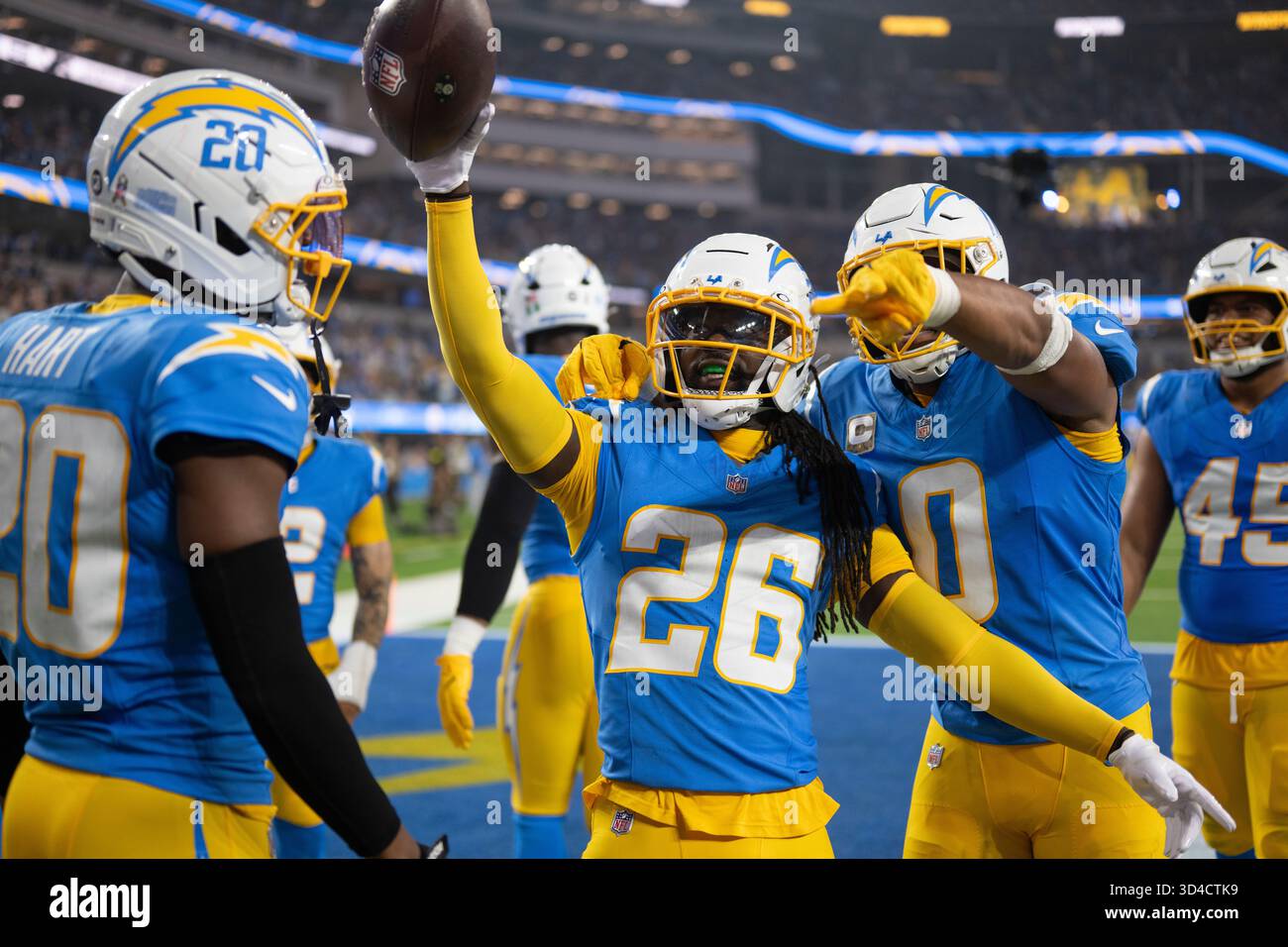 Los Angeles Chargers players celebrate an interception by cornerback ...