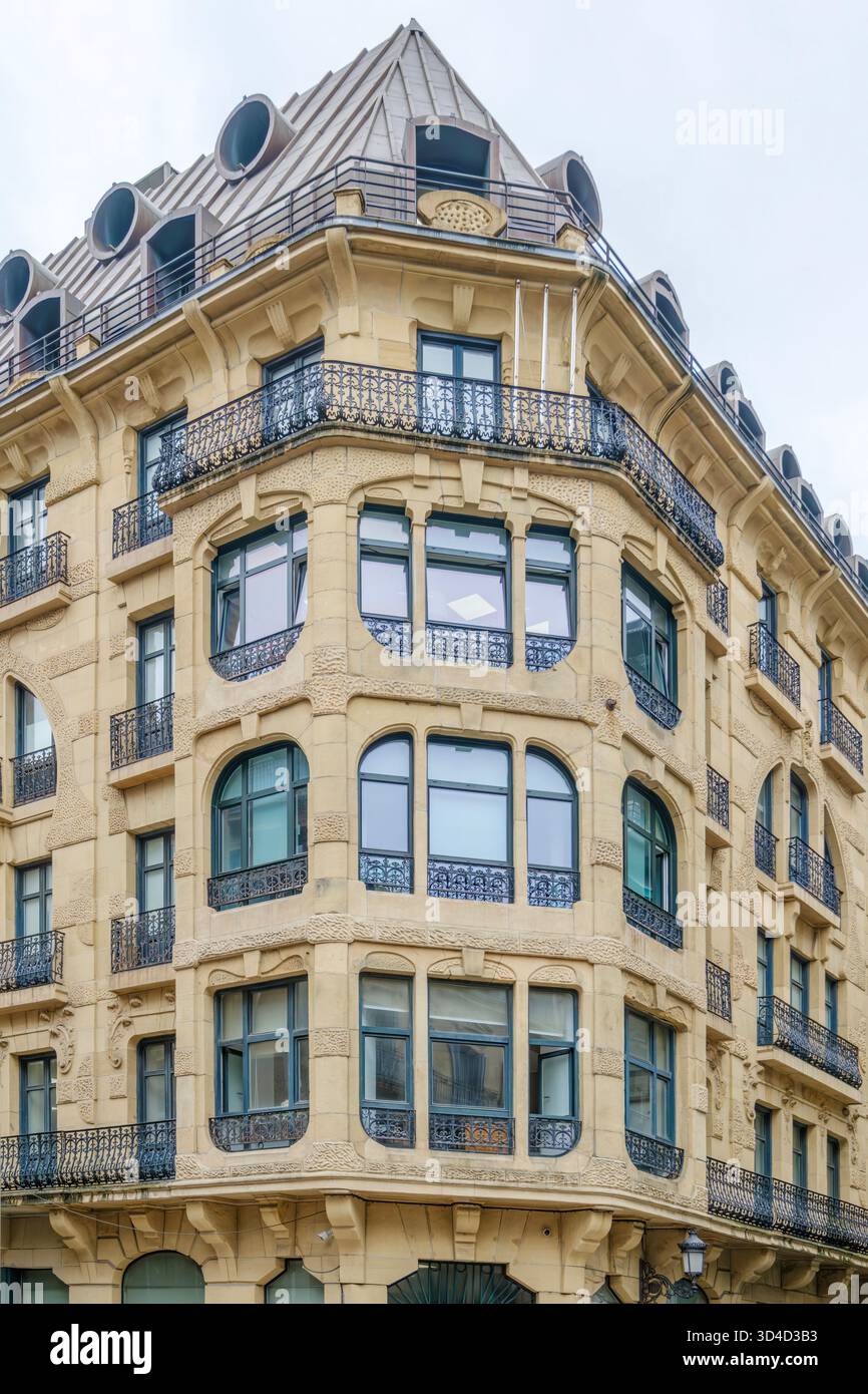 Historic Corner Building Facade with Ornate Forged Iron Balconies and ...